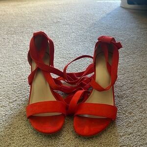 Strap up red high heels
